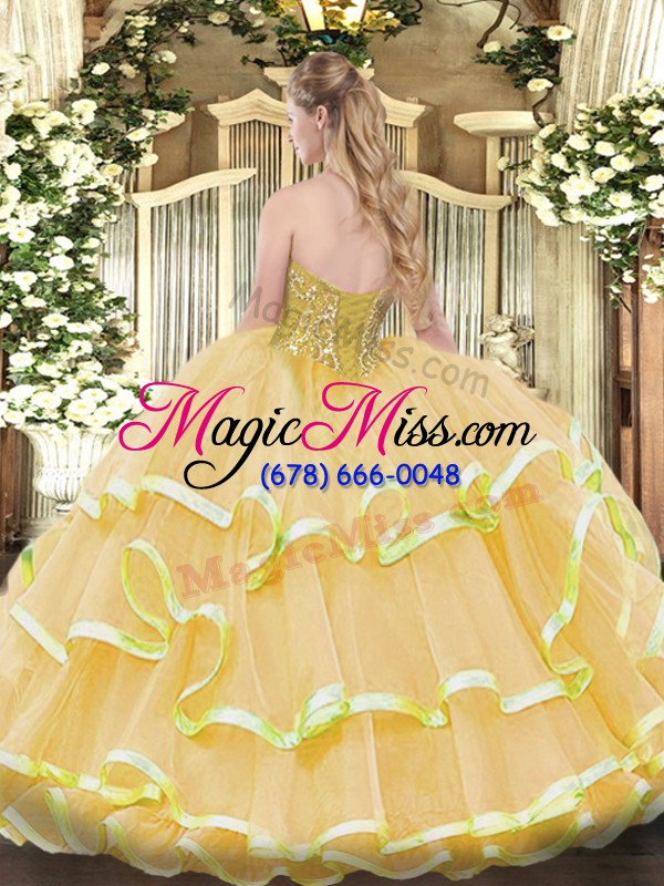 wholesale sweetheart sleeveless 15th birthday dress floor length beading and ruffled layers peach organza